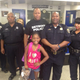 Samya McLaughlin poses with officers from the Detroit Police Department’s 11th Precinct July 9, 2016.
Jason Scott via Twitter